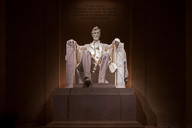 a massive sculpture of abraham lincoln at the lincoln memorial in washington dc photographed at night by Jacob Rosenfeld