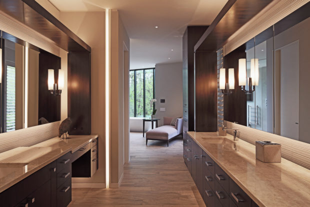 his and hers modern master bath floating vanities featuring dark wood, granite, and polished chrome fixtures, photographed by Jacob Rosenfeld